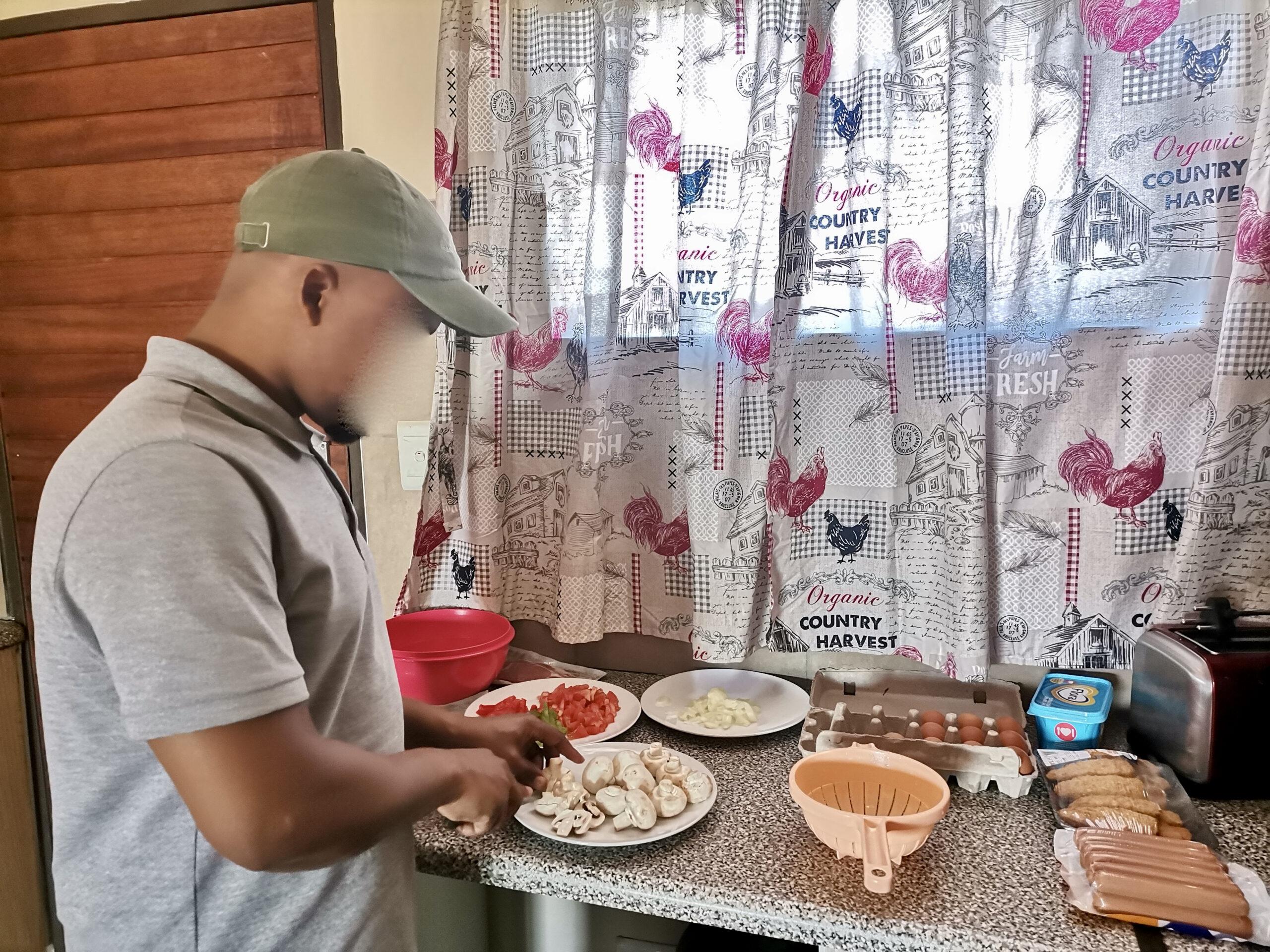 Man chopping mushrooms