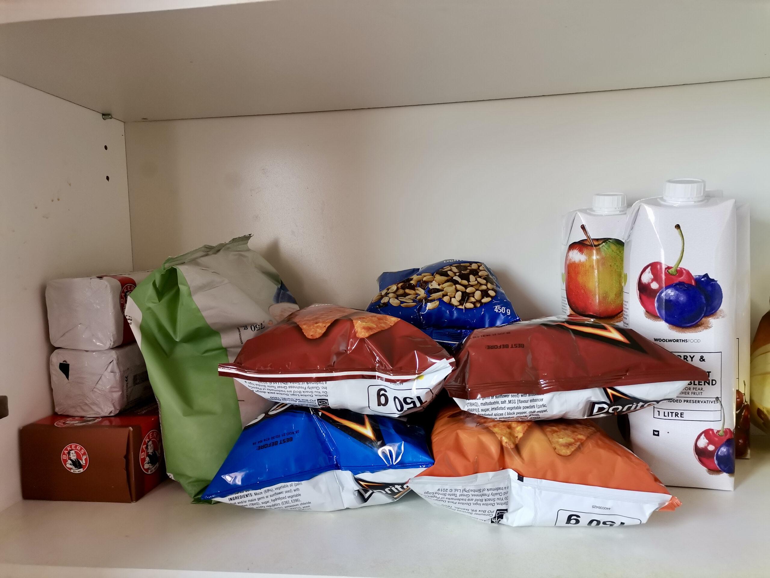 Shelf with biscuits and snacks
