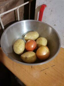 Potatoes and onions in a bowl