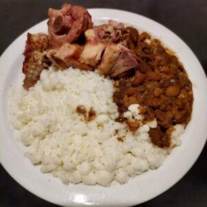 Plate of Turkey, beans and maize meal porridge