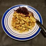Dinner plate with macaroni and minced beef with cooked beetroot