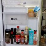 Fridge door with ultra-pasteurised milk and condiments