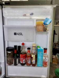 Fridge door with ultra-pasteurised milk and condiments