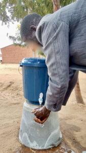 Photo of man washing his hands
