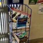 eThekwini Municipality health information stand with pamphlets inside the clinic entrance next to a “Stop TB” poster.