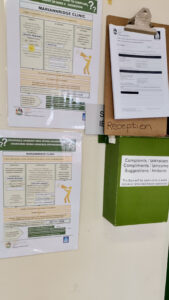 Mariannridge clinic complains or compliments poster in English and isiZulu next to the complaints, compliments and suggestions box.
