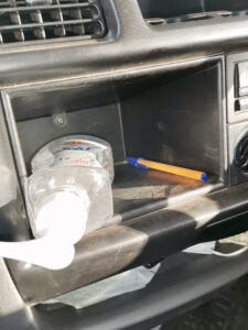 Hand sanitiser in glove compartment of car