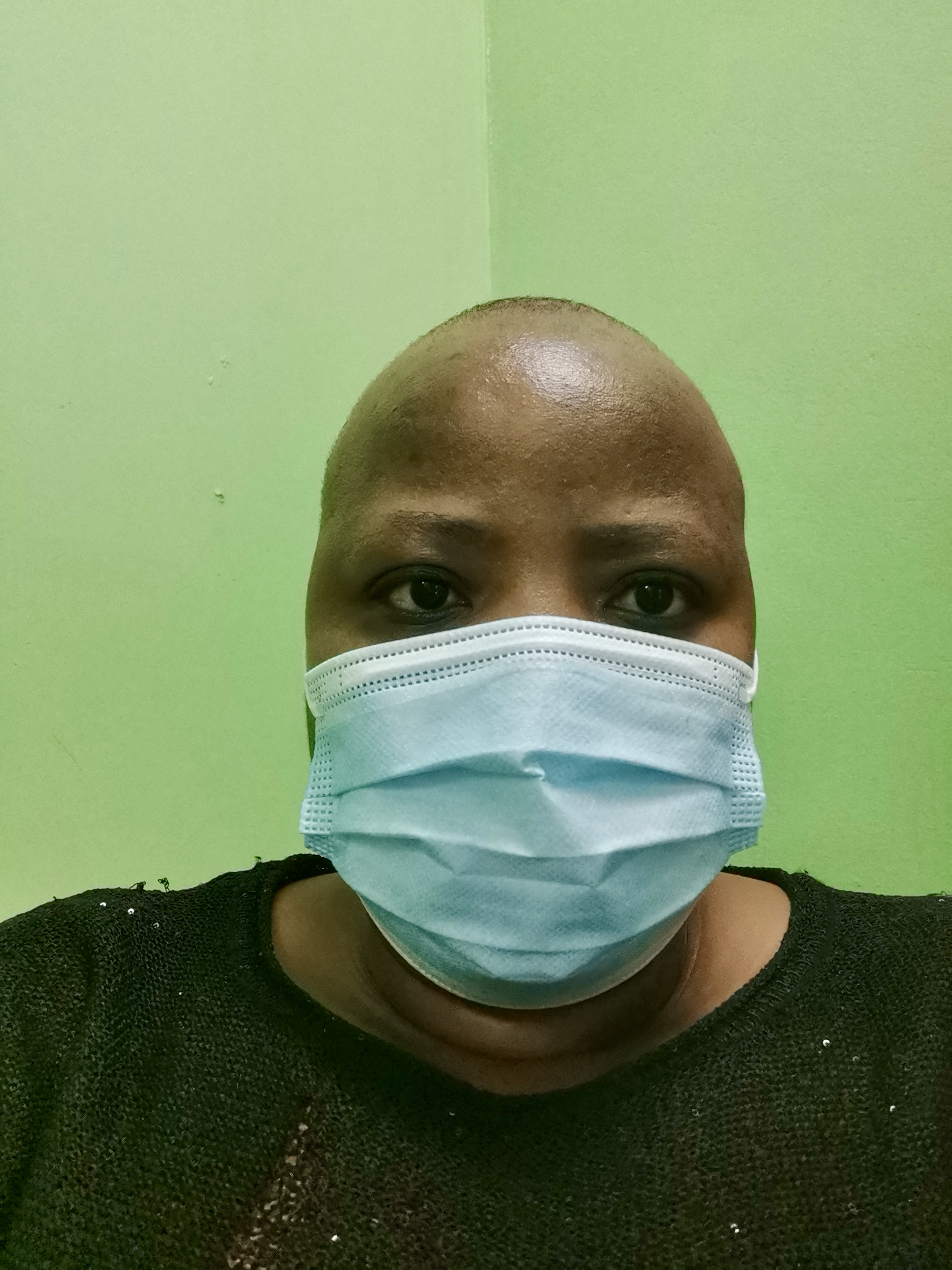 Selfie of Superwoman wearing a mask